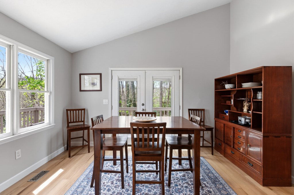 1682 Settlement Road Young Harris, GA 30582 - Photo 18 of 72 a view of a dining room with furniture window and wooden floor