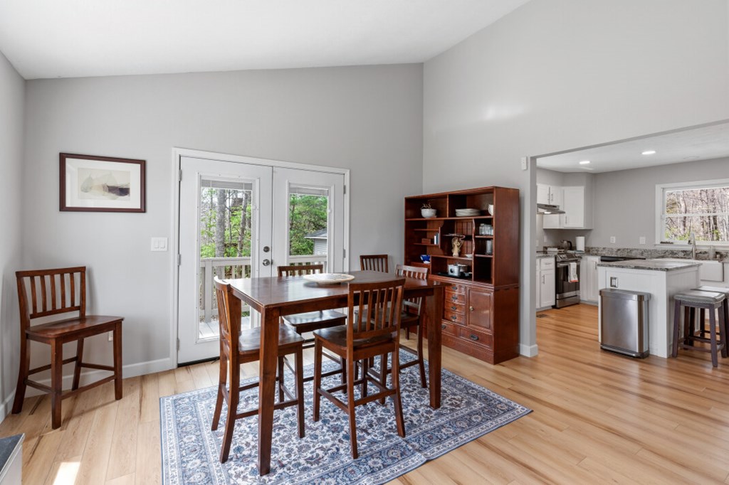 1682 Settlement Road Young Harris, GA 30582 - Photo 19 of 72 a view of a dining room with furniture and wooden floor