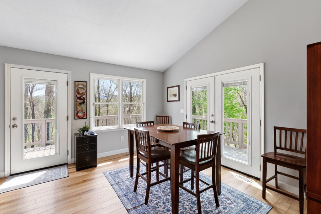 1682 Settlement Road Young Harris, GA 30582 - Photo 20 of 72 a view of a dining room with furniture window and wooden floor