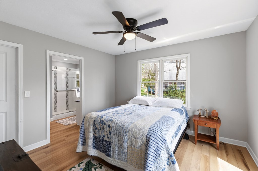 1682 Settlement Road Young Harris, GA 30582 - Photo 22 of 72 a bedroom with a bed and wooden floor