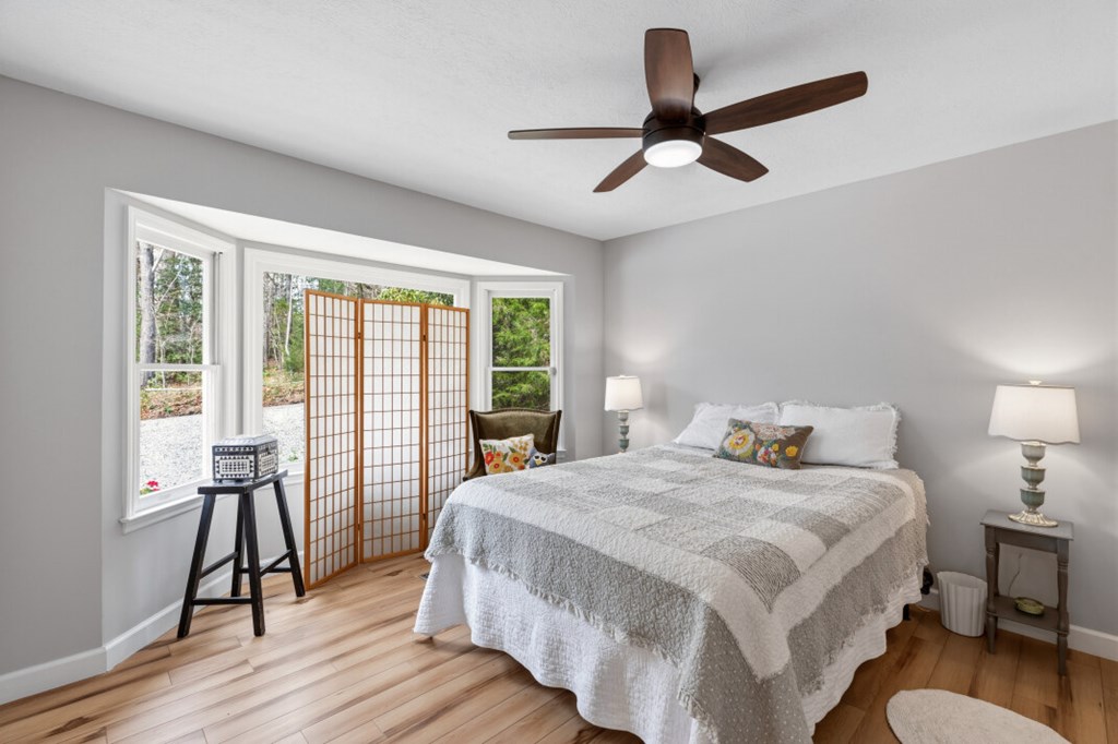 1682 Settlement Road Young Harris, GA 30582 - Photo 33 of 72 a bedroom with a bed and a large window