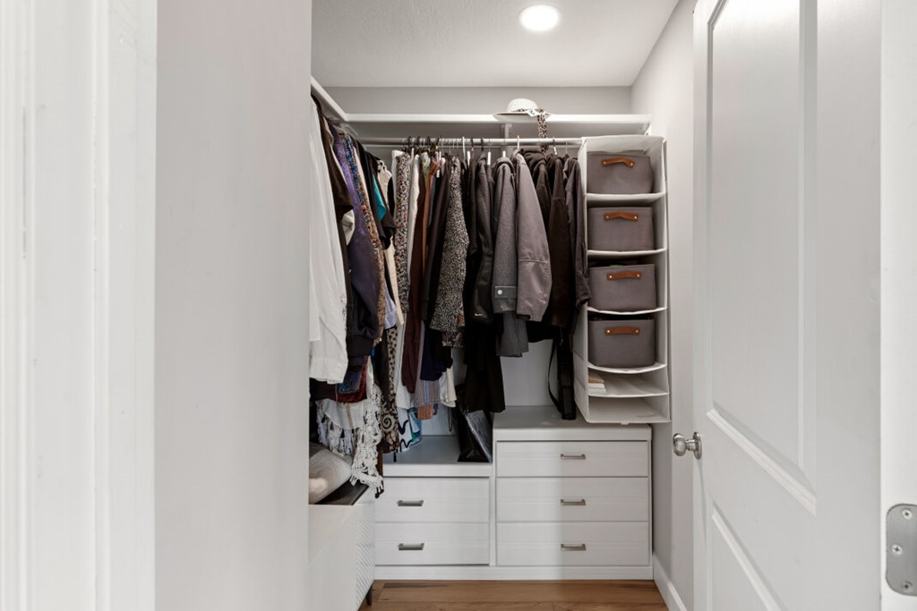 1682 Settlement Road Young Harris, GA 30582 - Photo 36 of 72 a view of walk in closet with clothes