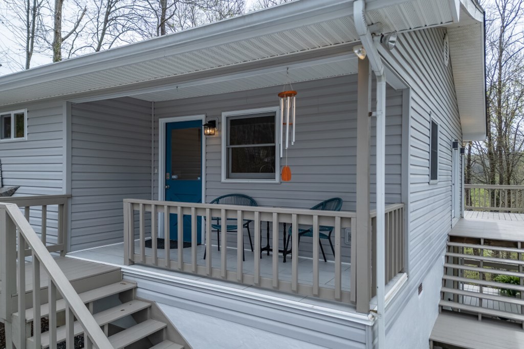 1682 Settlement Road Young Harris, GA 30582 - Photo 4 of 72 a view of a house with staircase and wooden fence