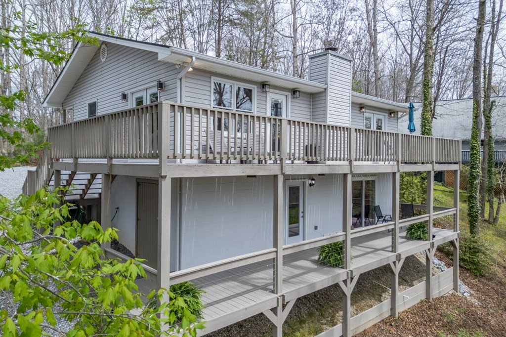 1682 Settlement Road Young Harris, GA 30582 - Photo 42 of 72 a view of a house with wooden deck and backyard