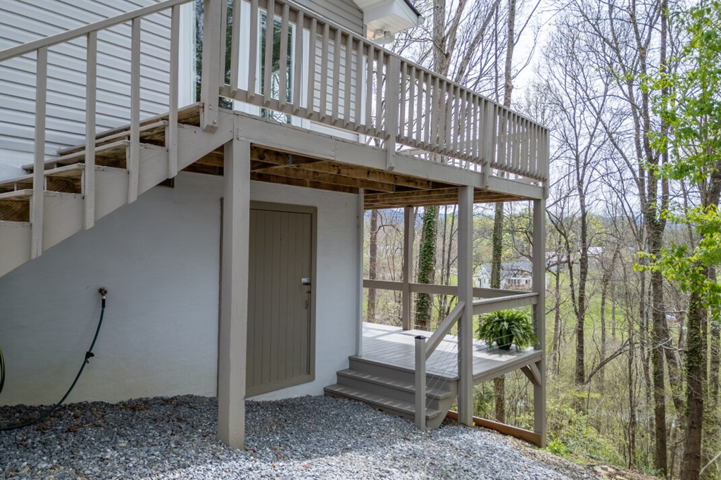 1682 Settlement Road Young Harris, GA 30582 - Photo 44 of 72 a view of a porch with furniture and floor to ceiling window