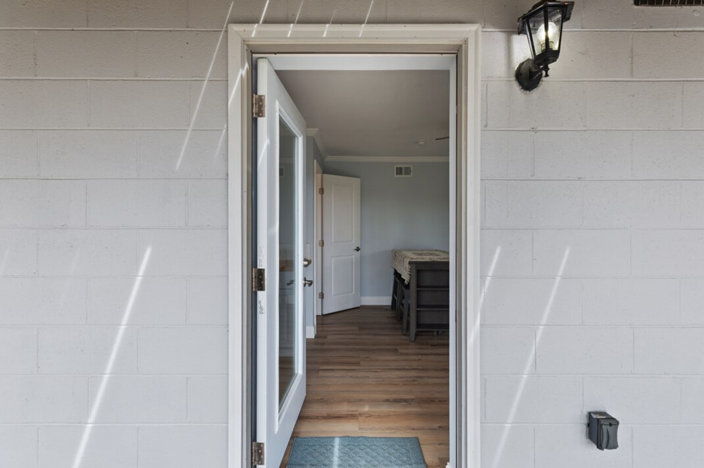 1682 Settlement Road Young Harris, GA 30582 - Photo 46 of 72 a view of a hallway with wooden floor and staircase