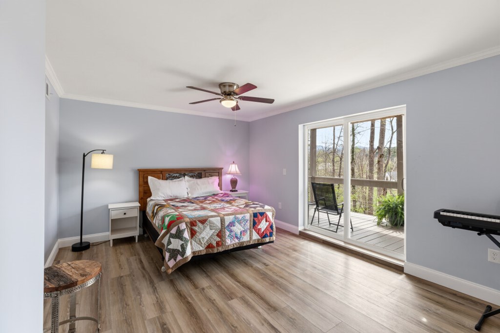 1682 Settlement Road Young Harris, GA 30582 - Photo 54 of 72 a bedroom with a bed and a large window