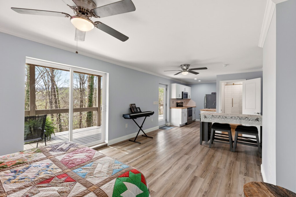 1682 Settlement Road Young Harris, GA 30582 - Photo 55 of 72 a view of a livingroom with furniture window and wooden floor