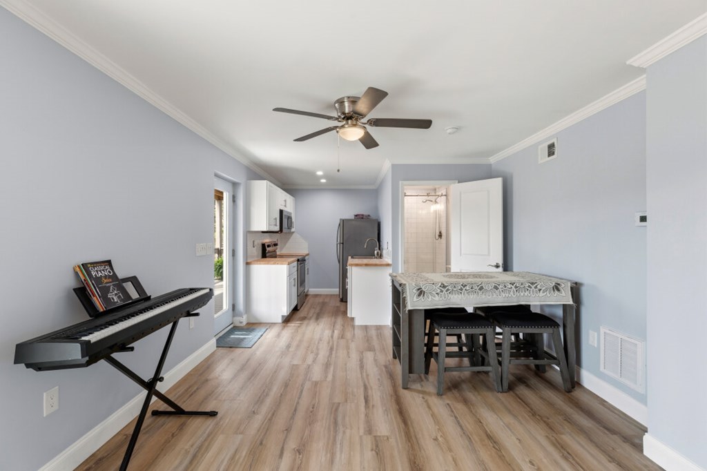 1682 Settlement Road Young Harris, GA 30582 - Photo 56 of 72 a dining room with furniture and wooden floor