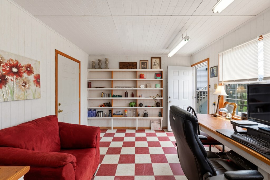 1682 Settlement Road Young Harris, GA 30582 - Photo 59 of 72 a living room with furniture and a fireplace