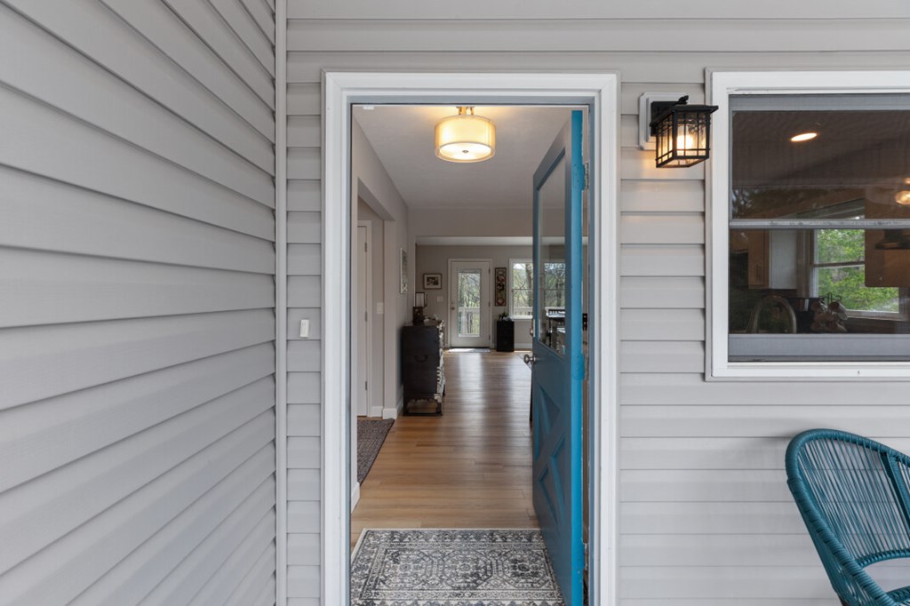 1682 Settlement Road Young Harris, GA 30582 - Photo 6 of 72 a view of a hallway with wooden floor and a cabinet