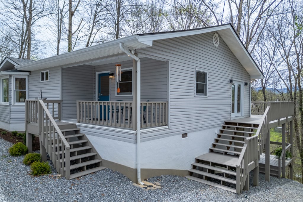 1682 Settlement Road Young Harris, GA 30582 - Photo 61 of 72 a view of a house with backyard and deck