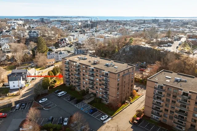an aerial view of a residential building with an outdoor space