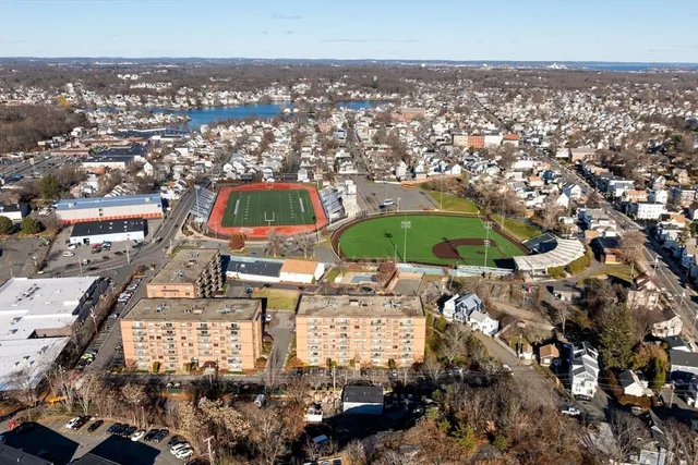 an aerial view of residential houses with outdoor space
