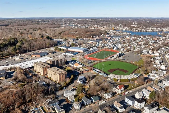 an aerial view of residential houses with outdoor space
