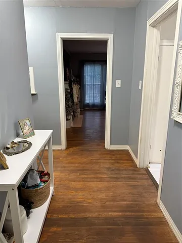 a view of a kitchen from the hallway