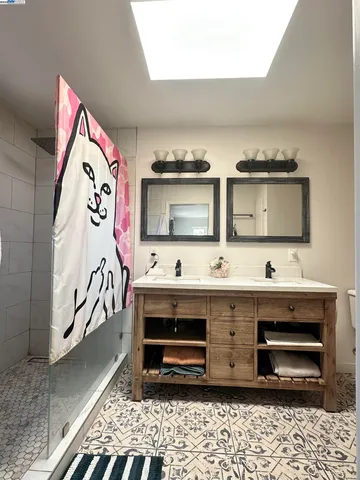 a view of a pathway of a house with potted plants