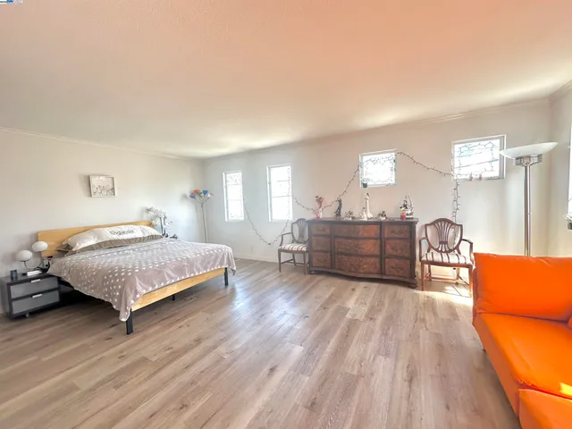 a room that has a bed and a mirror in it