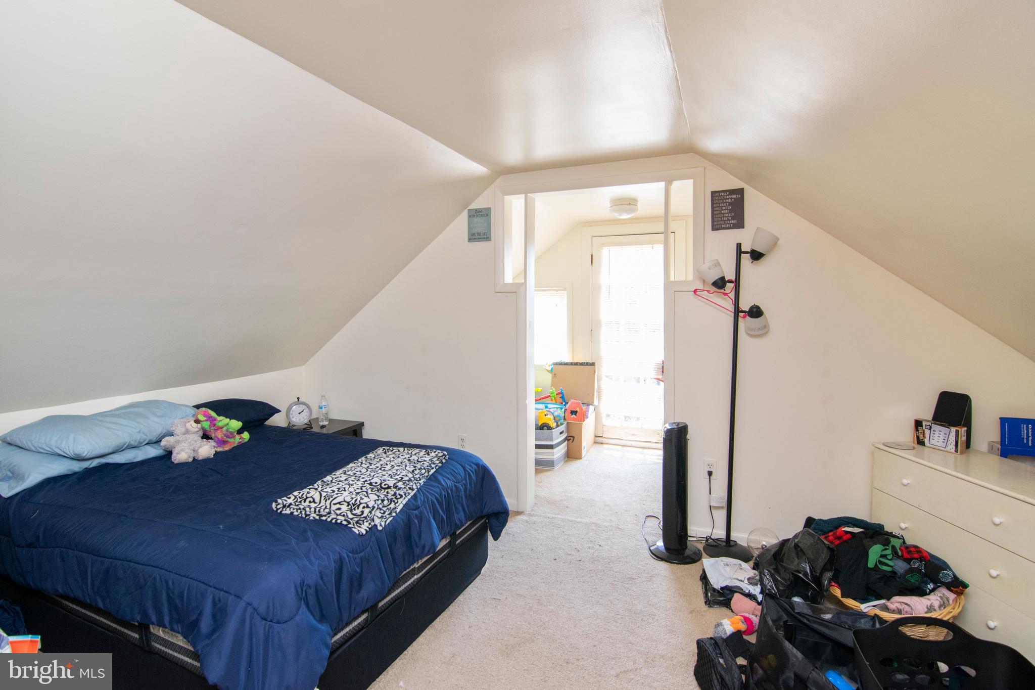 8438 Church Road Pasadena, MD 21122 - Photo 24 of 25 a bedroom with a bed and a window