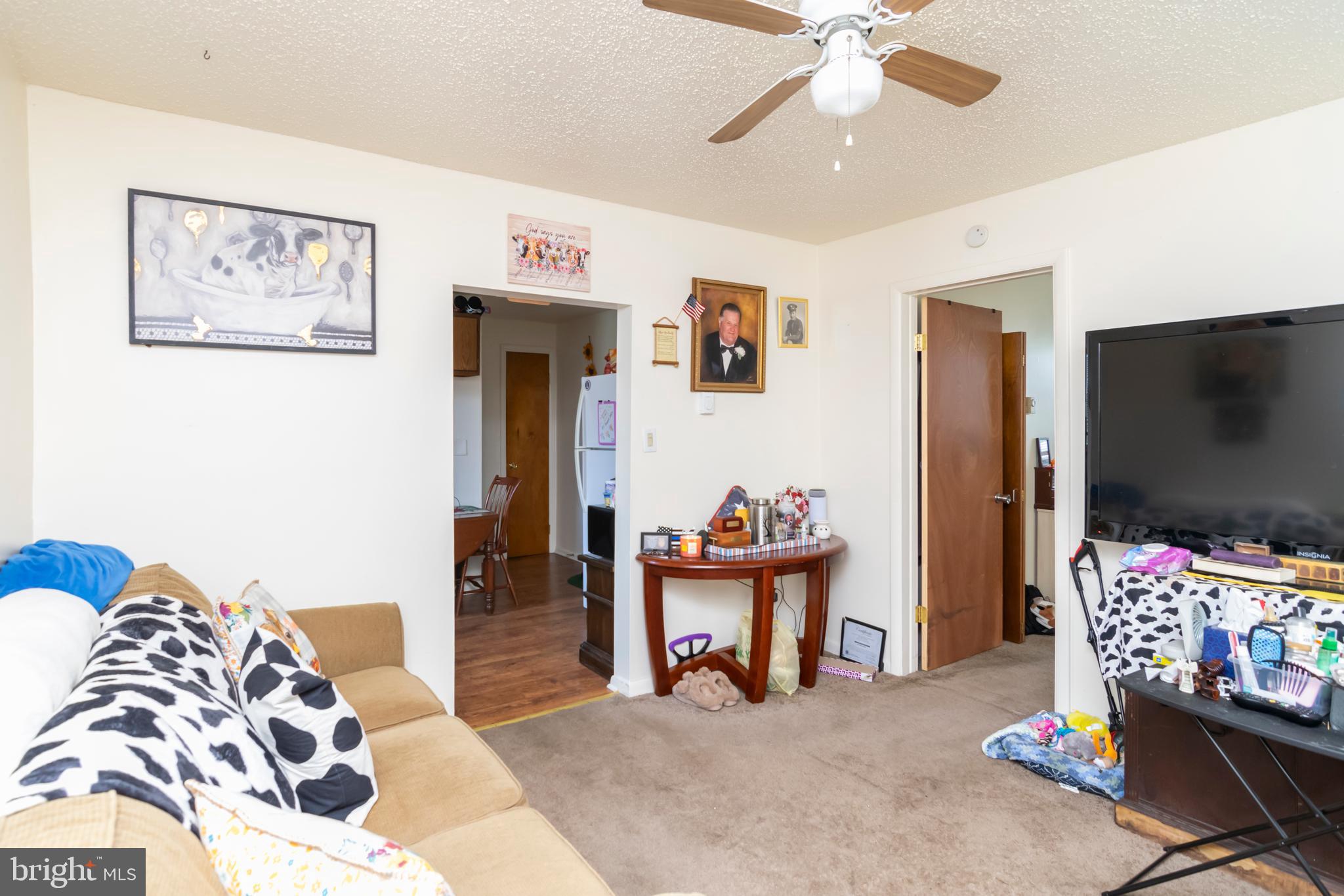 8438 Church Road Pasadena, MD 21122 - Photo 3 of 25 a living room with furniture and a flat screen tv