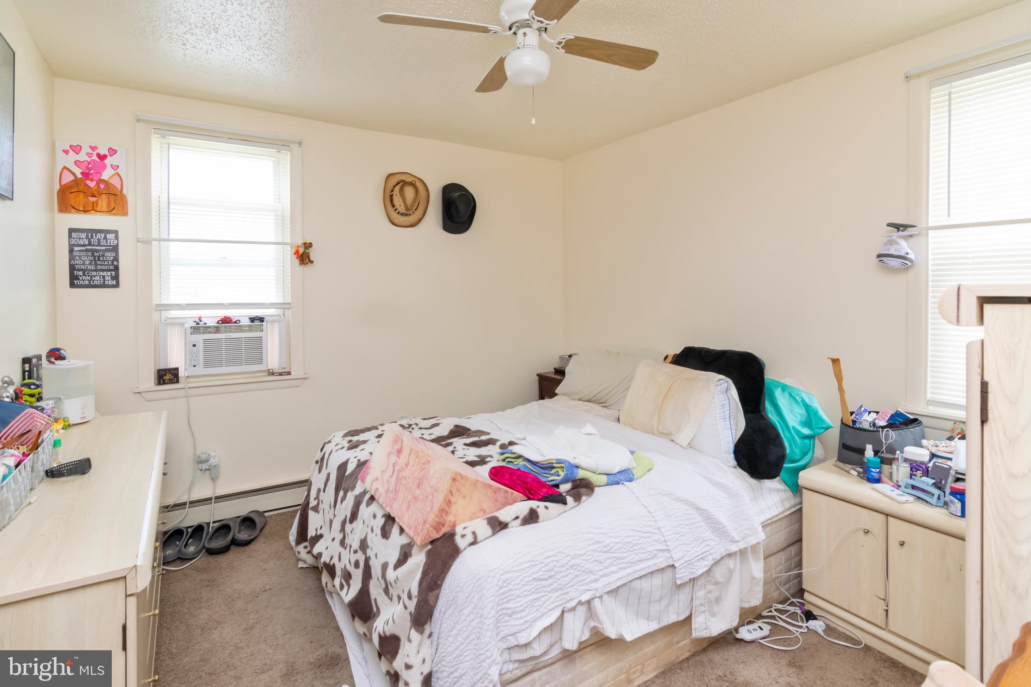 8438 Church Road Pasadena, MD 21122 - Photo 5 of 25 a bedroom with a bed and a window