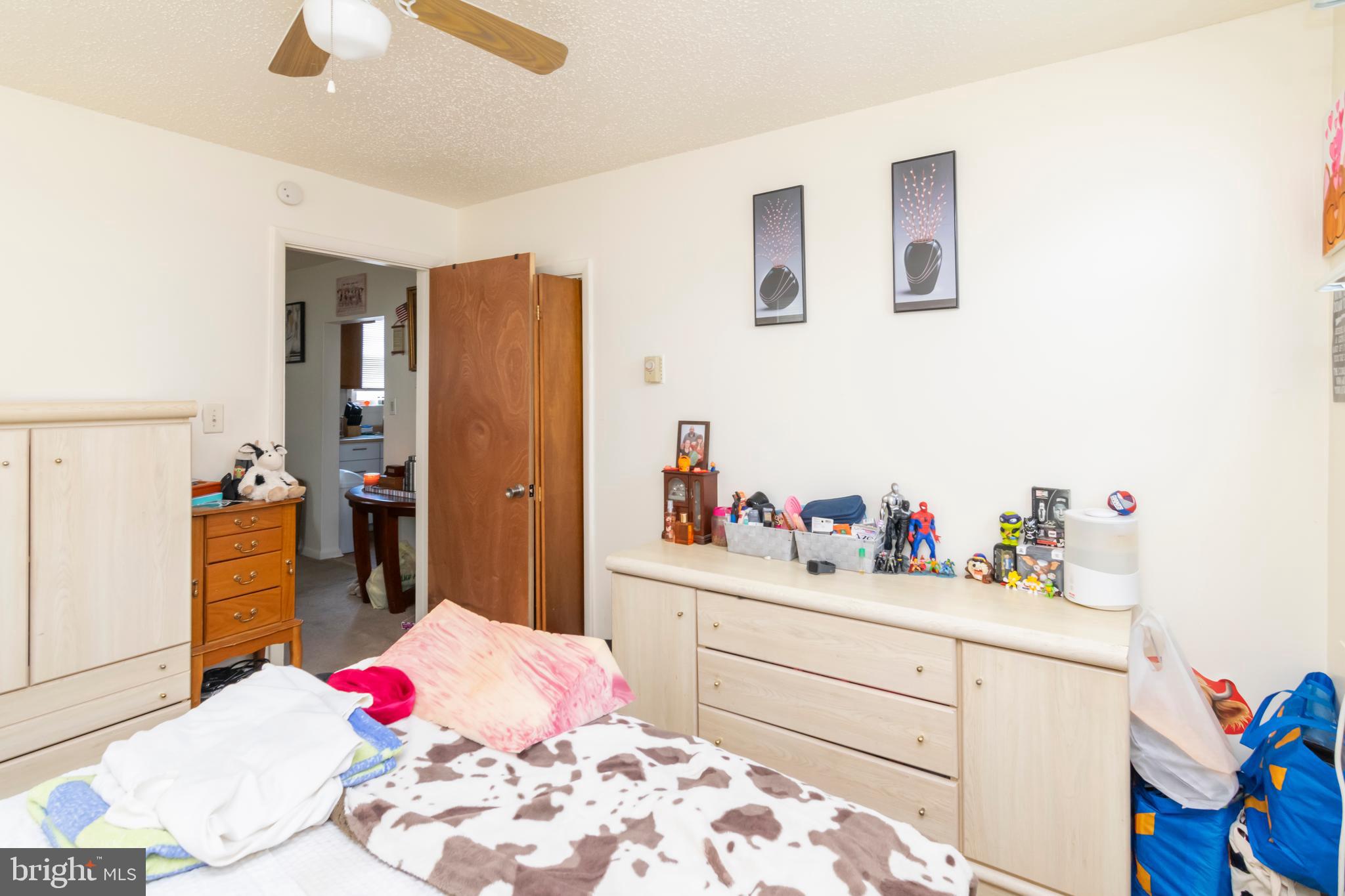 8438 Church Road Pasadena, MD 21122 - Photo 6 of 25 a bedroom with a bed and a dresser