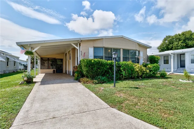 a view of a house with a back yard