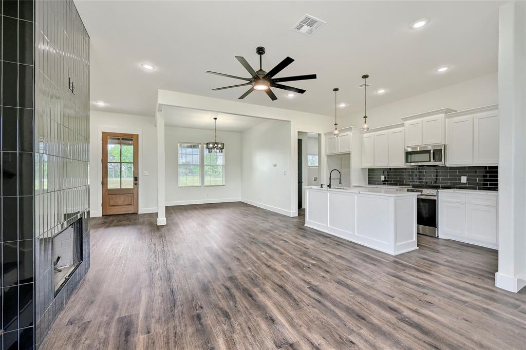 6091 Fm-1753 Denison, TX 75021 - Photo 11 of 40 a view of kitchen with cabinets stainless steel appliances and wooden floor