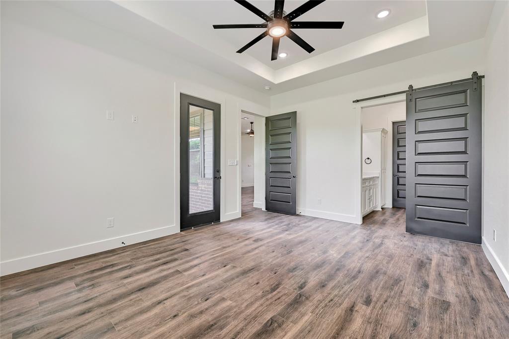 6091 Fm-1753 Denison, TX 75021 - Photo 16 of 40 wooden floor in an empty room with a window