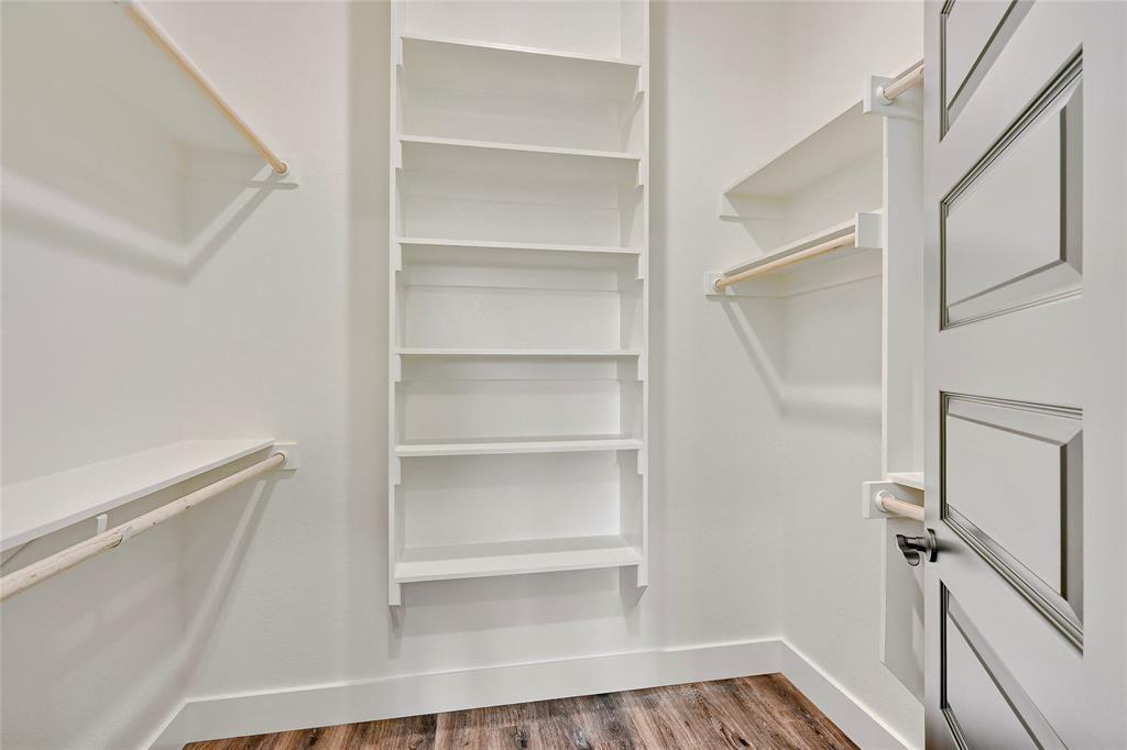 6091 Fm-1753 Denison, TX 75021 - Photo 20 of 40 a view of walk in closet with empty racks