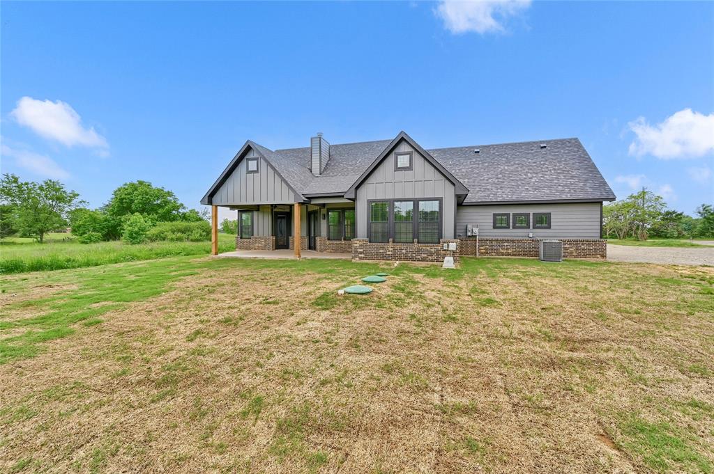 6091 Fm-1753 Denison, TX 75021 - Photo 2 of 40 a front view of a house with garden