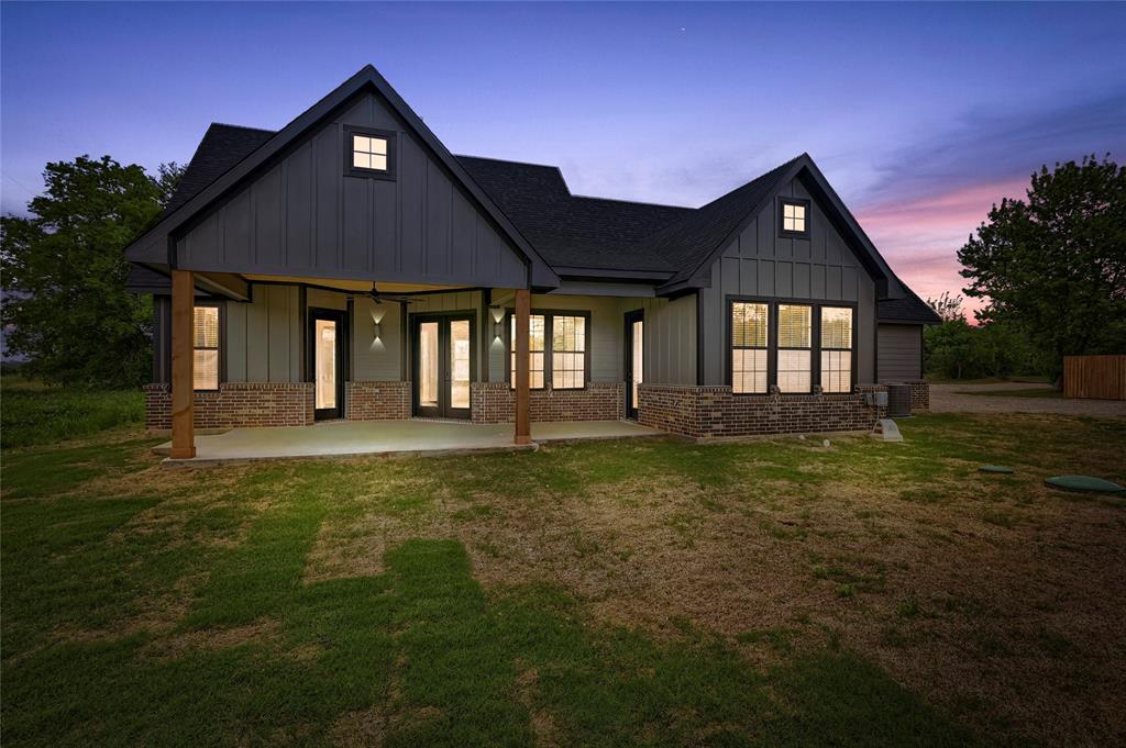 6091 Fm-1753 Denison, TX 75021 - Photo 31 of 40 a front view of a house with a yard