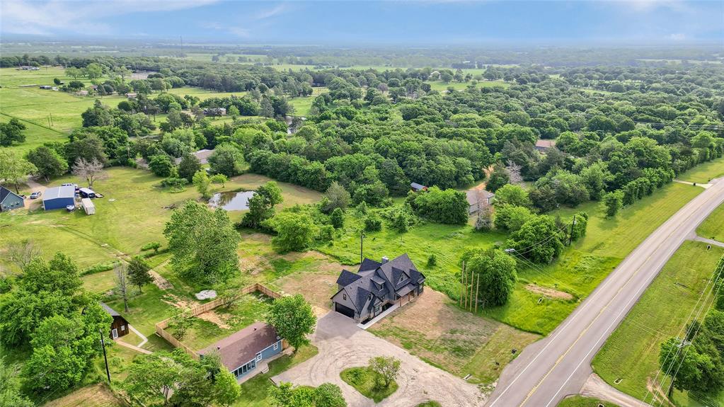 6091 Fm-1753 Denison, TX 75021 - Photo 36 of 40 a view of a garden with a building in the background
