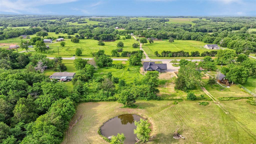 6091 Fm-1753 Denison, TX 75021 - Photo 37 of 40 an aerial view of residential houses with outdoor space and trees