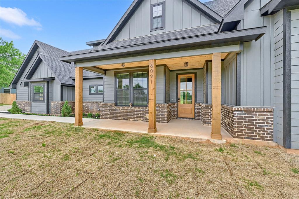 6091 Fm-1753 Denison, TX 75021 - Photo 4 of 40 front view of a house with a porch