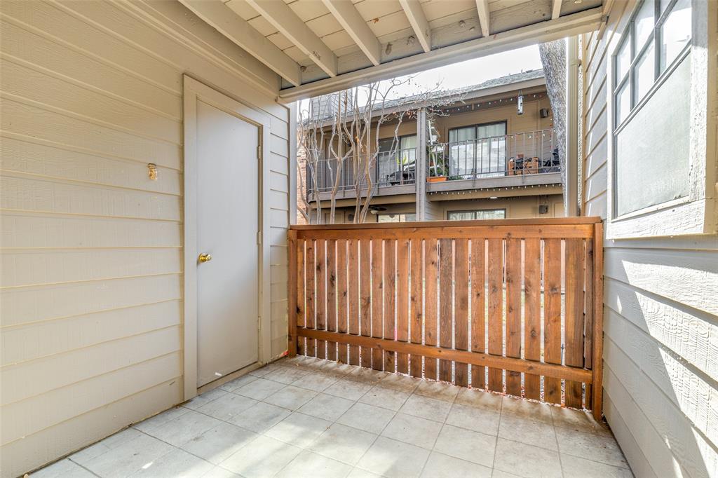 15221 Berry Trail, Unit 405 Dallas, TX 75248 - Photo 15 of 15 a view of a house with a porch
