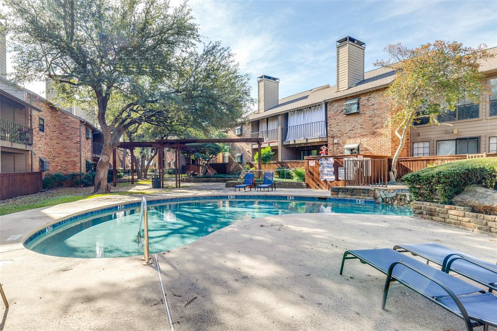 15221 Berry Trail, Unit 405 Dallas, TX 75248 - Photo 5 of 15 a swimming pool with outdoor seating and yard