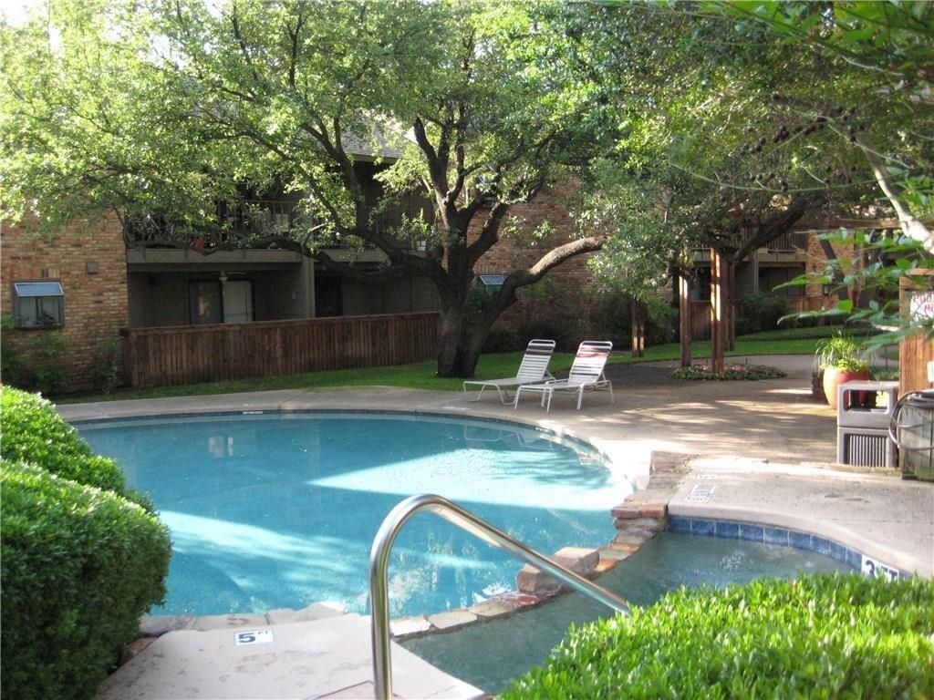 15221 Berry Trail, Unit 405 Dallas, TX 75248 - Photo 6 of 15 a view of a swimming pool with a patio