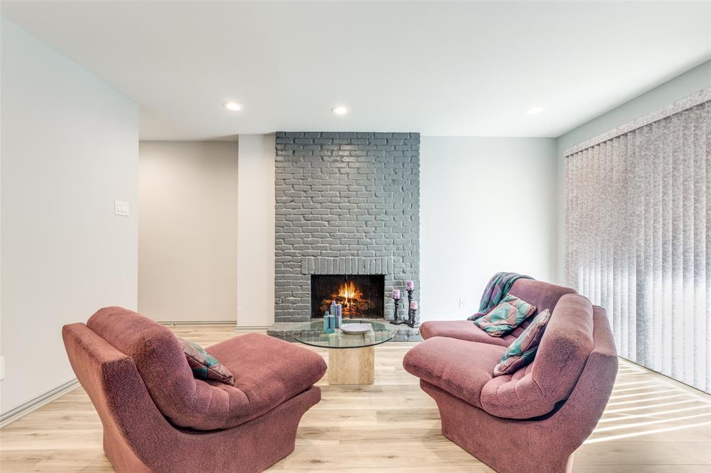 15221 Berry Trail, Unit 405 Dallas, TX 75248 - Photo 7 of 15 a living room with furniture fireplace and a window
