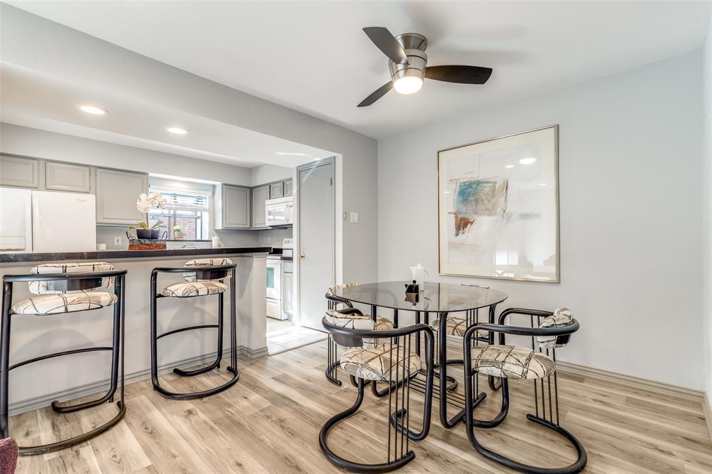 15221 Berry Trail, Unit 405 Dallas, TX 75248 - Photo 8 of 15 a dining room with furniture and wooden floor