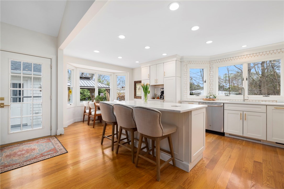 510 Boston Neck Road North Kingstown, RI 02852 - Photo 11 of 43 Sun-filled and impeccable, this chef's kitchen provides ample storage, seating and access to the deck from this side door!