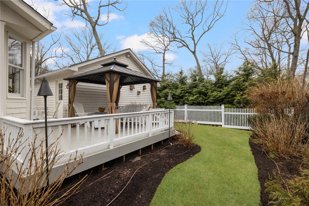 510 Boston Neck Road North Kingstown, RI 02852 - Photo 15 of 43 Plenty of space for relaxing and entertaining, with pretty perennials!