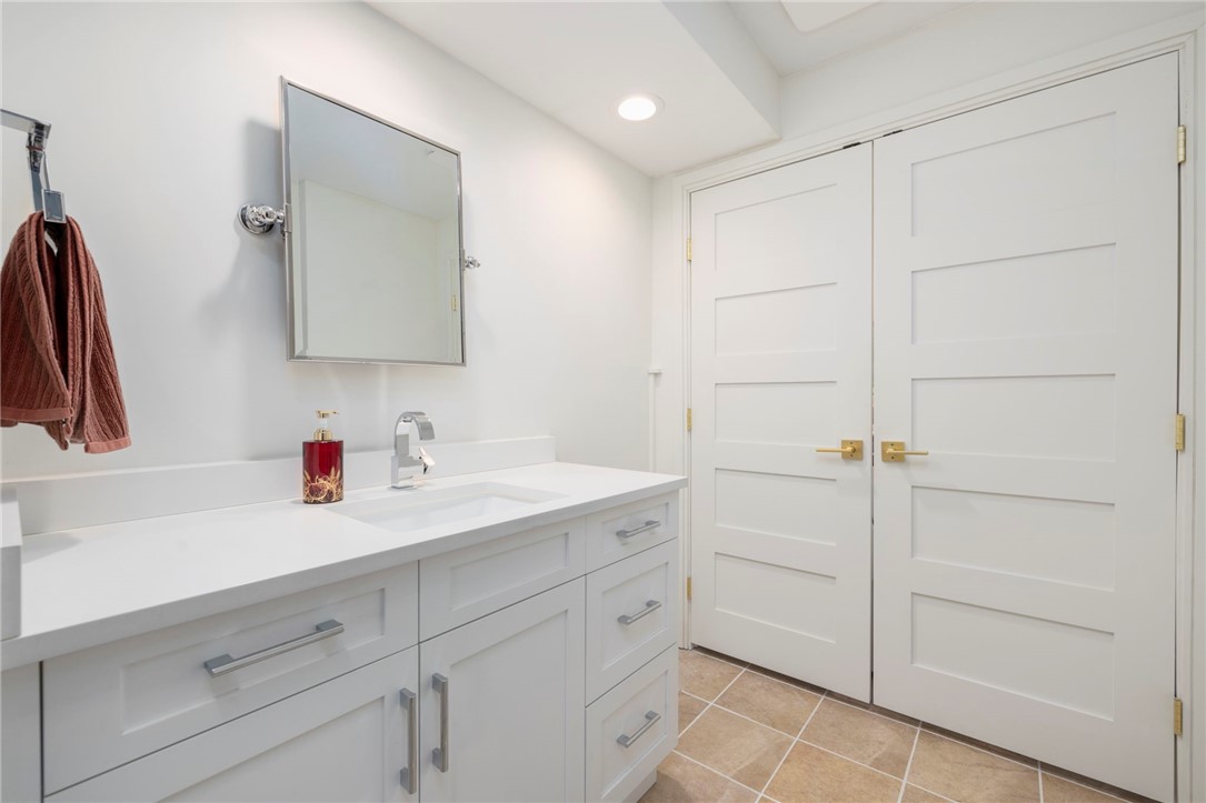 510 Boston Neck Road North Kingstown, RI 02852 - Photo 26 of 43 Primary bath has custom doors to laundry area.