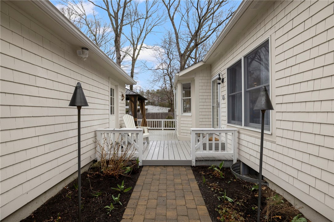 510 Boston Neck Road North Kingstown, RI 02852 - Photo 41 of 43 Walkway from driveway to side door, also has access to garage side door and deck!