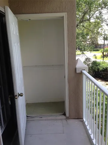a view of a park with large trees