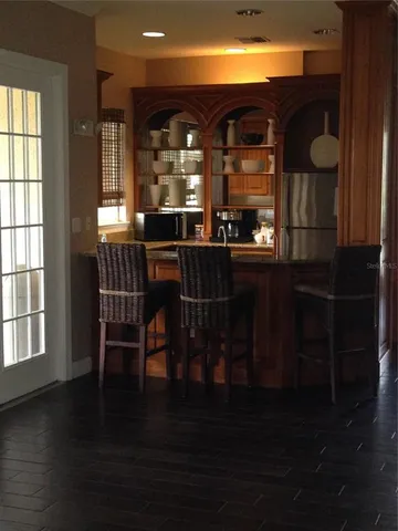 a living room with furniture a rug and a large window