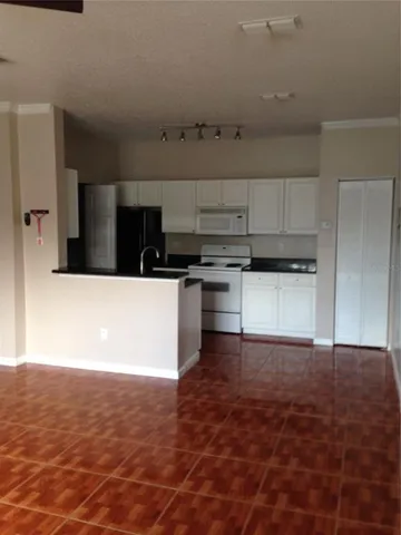 a view of a kitchen with a sink and a stove