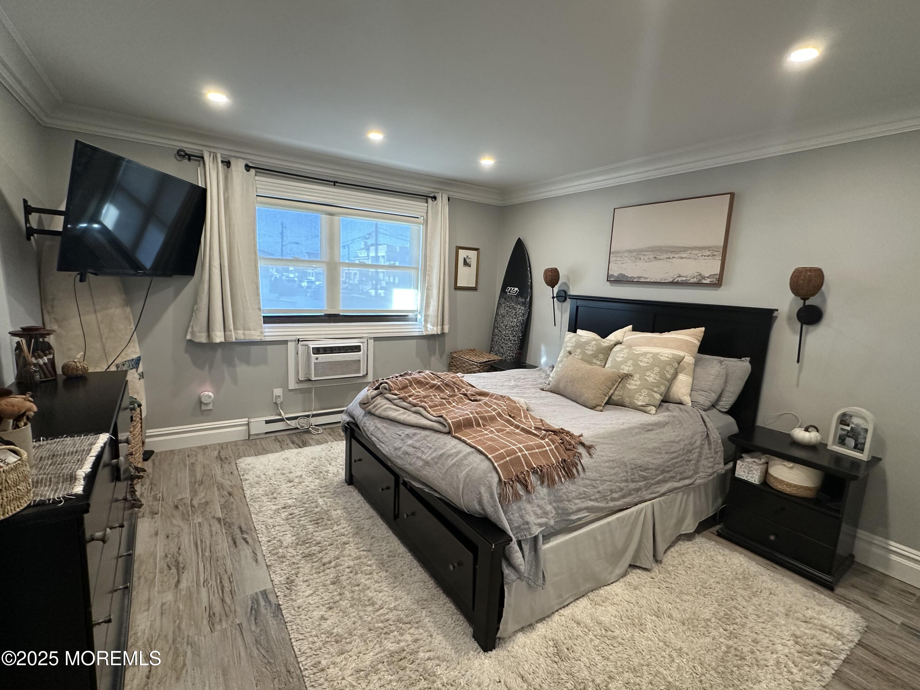 1501 Ocean Avenue, Unit A15 Belmar, NJ 07719 - Photo 9 of 17 a bed room with a bed and a television