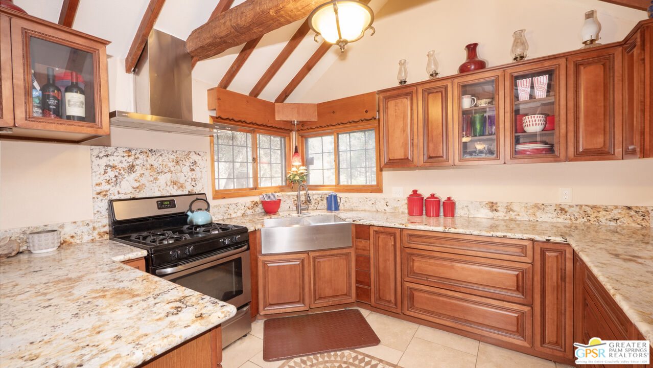76 7 Oaks Road Angelus Oaks, CA 92305 - Photo 7 of 35 a kitchen that has a sink and a stove