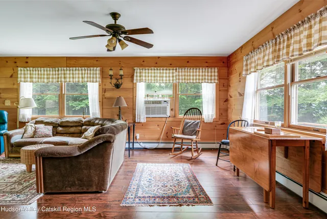 a living room with furniture windows and a fireplace